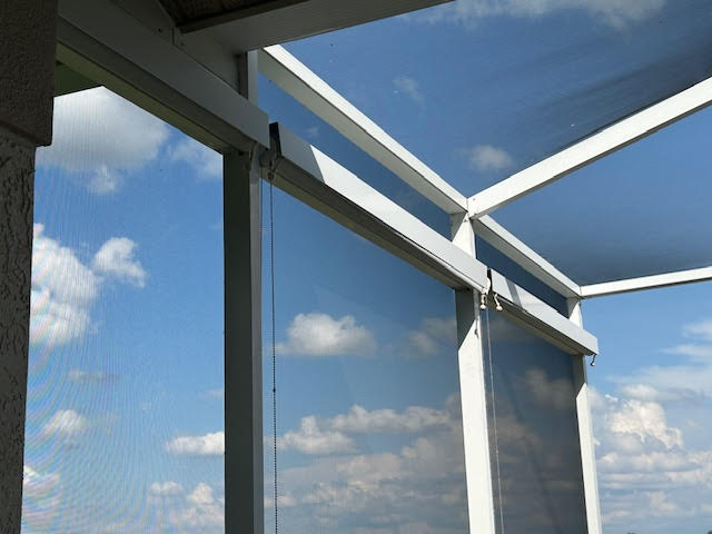 Roller shades rolled up and hidden in cassette