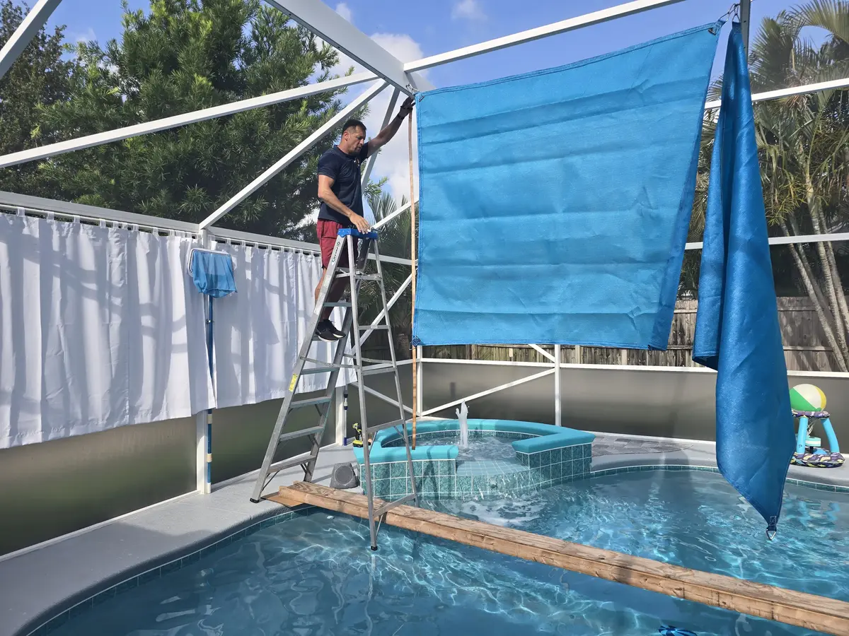 Shade sails covering pool enclosure in Central Florida