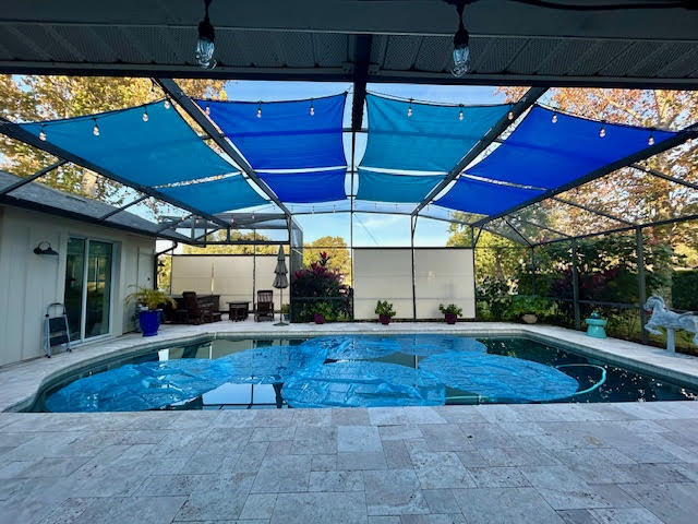 Lagoon blue shade sails over pool alternate angle